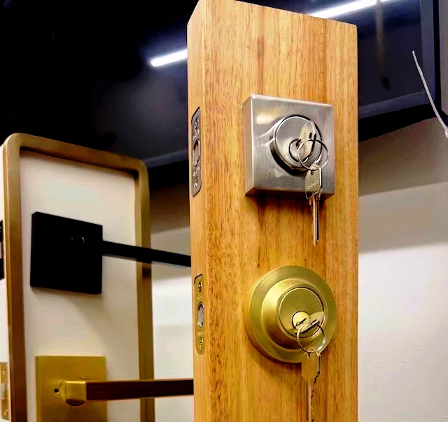 Display deadbolt and mortise lock cylinders with keys at Aura Locksmith's Brooklyn storefront